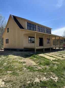 $69,995 Amish-Built Cabin with a Stunning Double Porch